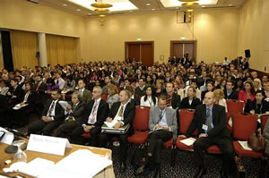 A wide view of the seated conference audience
